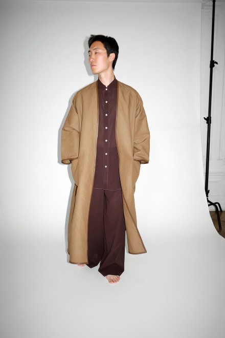 Collarless coat with leather piping